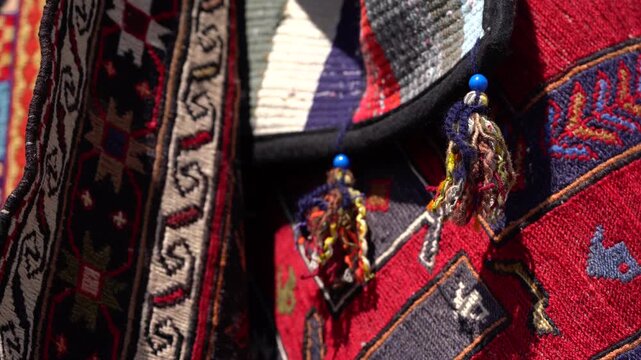 4K Close-Up of Traditional Turkish Kilim with Evil Eye Beads and Vibrant Ethnic Patterns