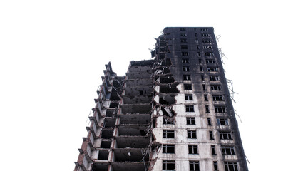 Isolated severely damaged, burned, and ruined multi-story building after war or catastrophe. © Maria