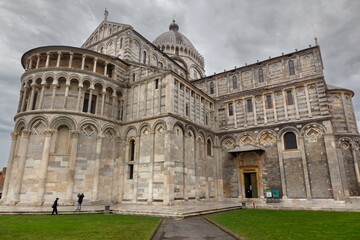 Fototapeta premium Catholic Cathedral, or Duomo di Pisa, Exterior at Piazza dei Miracoli Complex by famous Leaning Tower, Pisa Tuscany Italy