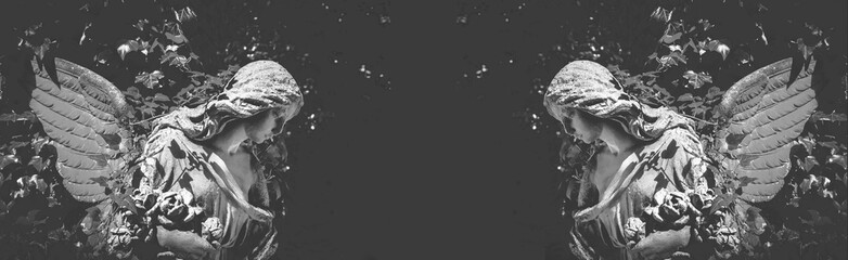 Fototapeta premium Symmetrical angel statues on dark background with copy space, symbolizing mourning, remembrance and spiritual peace in a minimal conceptual composition.