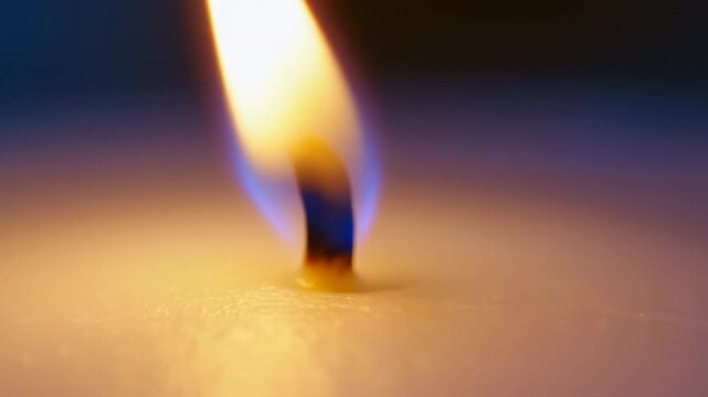 Intimate Candle Imagery. Closeup Of Burning Wick With Soft Golden Illumination And Blurry Background