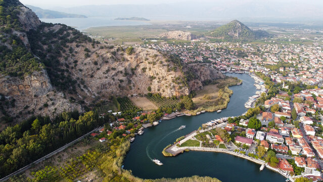 Aerial High Angle View of Dalyan River Canal and Town with Mountains and Boats in Mugla Turkey