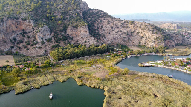 Aerial High Angle View of Dalyan River Canal and Town with Mountains and Boats in Mugla Turkey