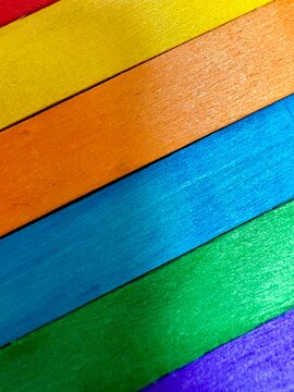 frame macro of multicolored craft sticks, pride and creativity concept