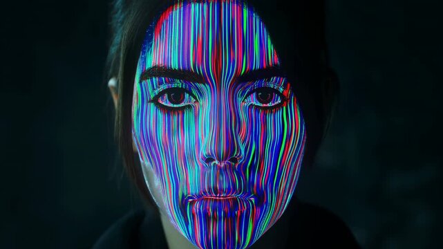 Neon Face Art. Cinematic Closeup Captures Intense Gaze And Augmented Reality Makeup Effects On Model