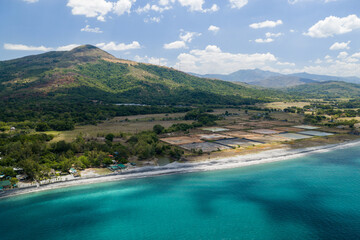 Fototapeta premium Scenic Panorama Aerial Drone Picture of the crystal clear water and the beach and Mount Katung-uhan in Botolan, Zambales in the Philippines 