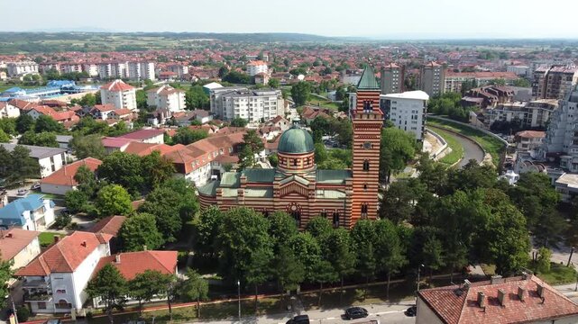 Drone glides toward the Church of Holy Trinity, an iconic landmark of town Paracin in Serbia.