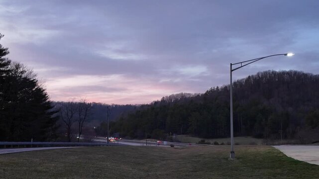 Traffic on Freeway Near Appalachian Mountains at Night