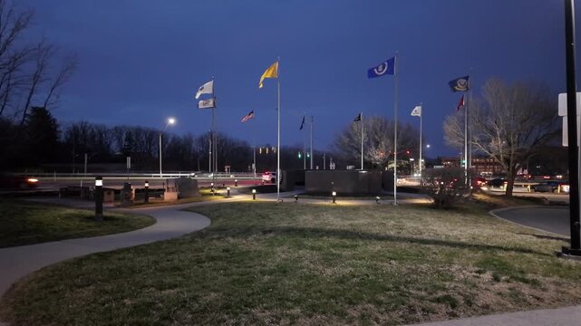 West Virginia Rest Stop With Flags and Traffic During Nighttime
