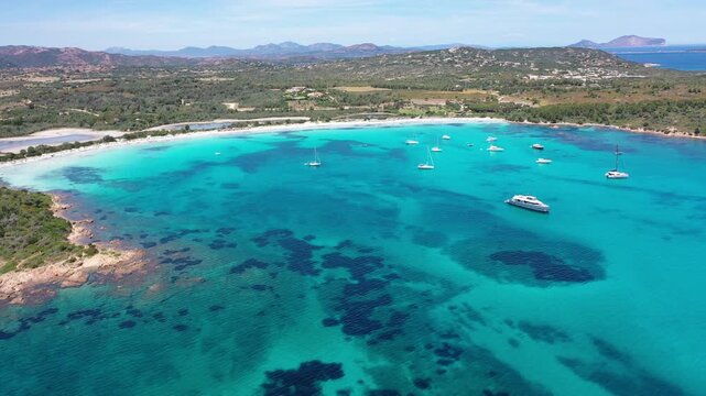 4K Aerial View of Cala Brandinchi SARDINIA  , Lu Impostu Bays. Cinematic aerial Drone Flight over Little Tahiti Turquoise Sea and White Sand. San Teodoro  Best beaches of Sardegna and Europe tahity 4k