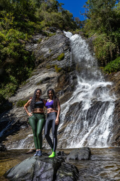 Mountaineers in front of a waterfall in the eastern part of Waraira Repano National Park in Guatire. Hiking in Latin America and the Caribbean. Exploring Venezuela