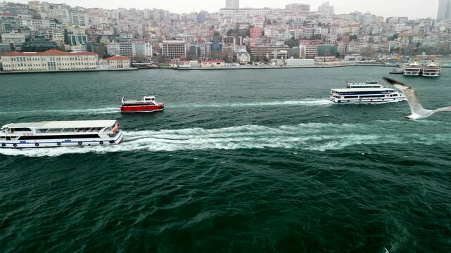 Istanbul/Turkey circa 2023: Ferry traffic at the Bosphorus strait shore