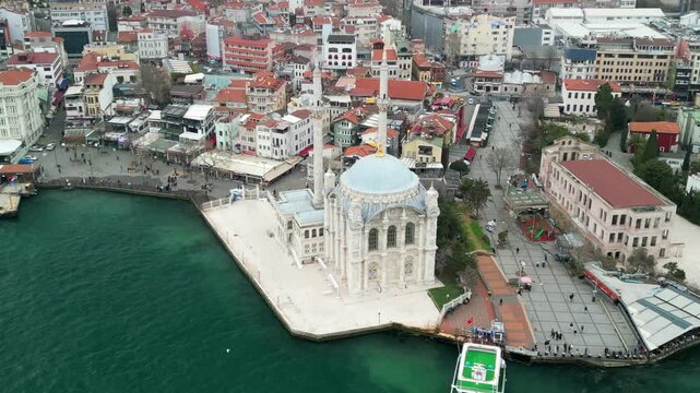 Grand Mecidiye Ortakoy Mosque with martyrs bridge in the back zoom-out shot