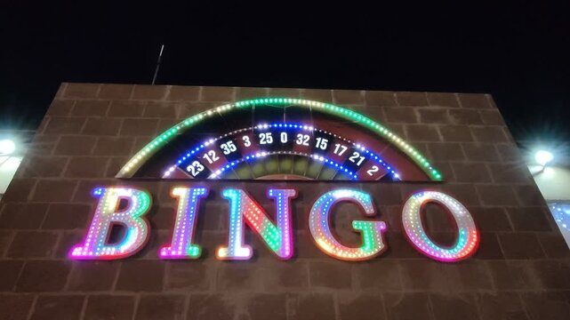 Flashing neon bingo sign at night