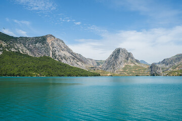 Obraz premium Panoramic Landscape view on green canyon Antalya Turkey with turquoise water mountain cliffs and green forest. Showcasing natural beauty travel tourist destination. Vacation concept slowing down. 