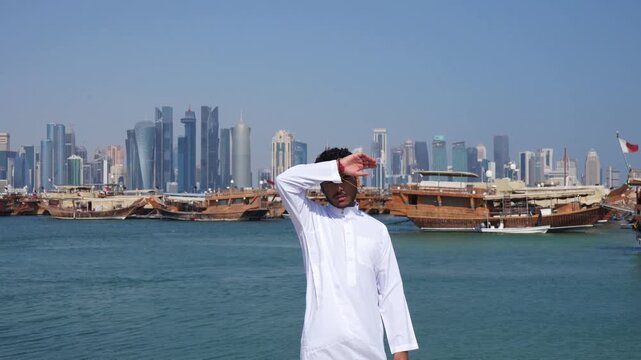 Skyline view with Arab man in Doha city