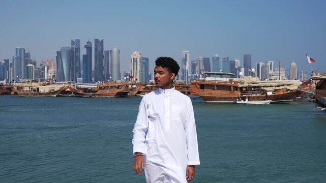 Middle Eastern man with modern skyscrapers background