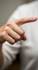 Naklejka premium Hand Pointing Right - Focused Gesture and Direction.