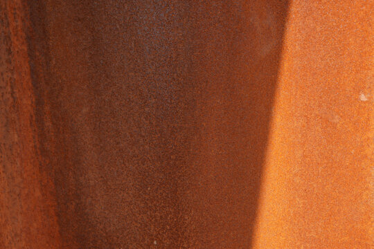 Rusty metal surface with varying shades of brown and orange
