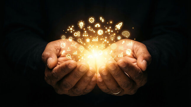 Close up of a person's cupped hands gently holding and presenting a bright glowing magical sphere of light surrounded by small shimmering golden icons in the darkness