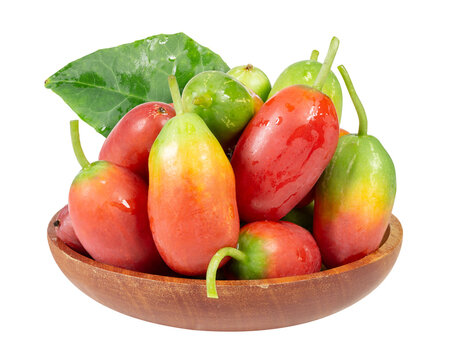 Ivy gourd fruits in wooden bowl, red green ripe fresh tropical organic vine vegetable isolated with leaf natural healthy food vibrant color