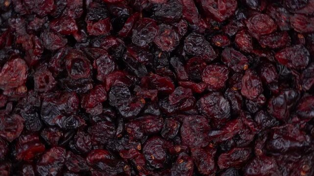 Top down view of a pile of sweet dried cranberries creating an abstract texture background