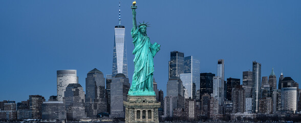 New York downtown district with Liberty Statue. New York panorama with the Liberty Statue. NYC panoramic cityscape and Statue of Liberty. Manhattan towers and Statue of Liberty. © Volodymyr