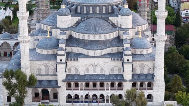 Aerial pull-up shot of Sultan Ahmed Mosque (Blue Mosque) and Taksim Square in Istanbul, Turkey.