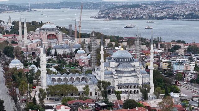 Aerial view of Hagia Sophia and Sultan Ahmed Mosque with the distant Bosphorus Strait in Istanbul, Turkey.
