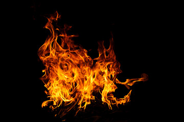 Fototapeta premium Burn effect pattern. Fire flames on black background. Burning fire backdrop. Blaze wallpaper. Abstract fire flame background. Fire flame texture.