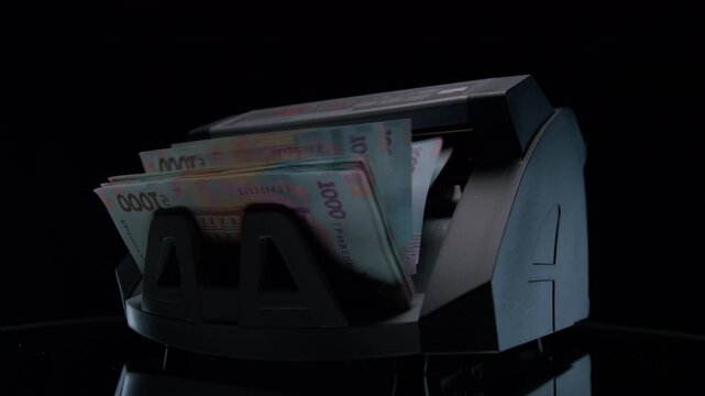 Cash Machine Counting 1000 Hryvnia Notes