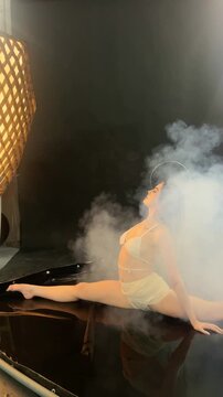 Graceful Angel Performs Splits in Smoke