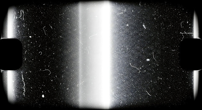 A black and white image of a light shining in a dark room