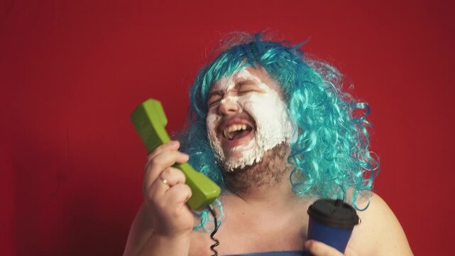 Funny fat man in a blue wig