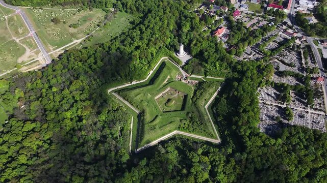 Aerial view of historic Prusy Fort surrounded by forest and urban area in Nysa Poland. Concept of military architecture cultural heritage and travel destination
