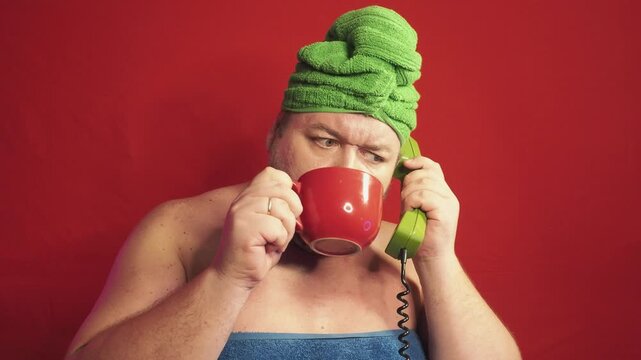 Funny fat man after a shower in a towel
