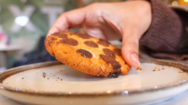 Freshly baked cookie on a plate in a cafe setting