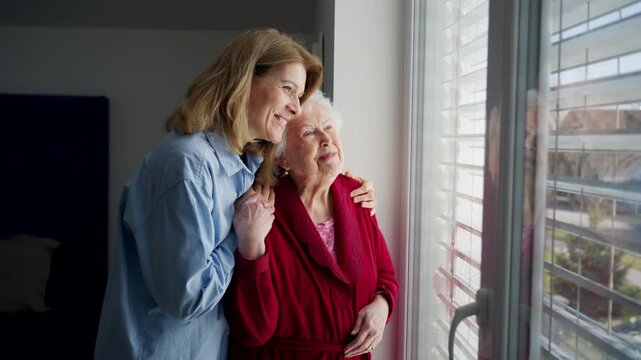 Mand adult daughter hugging, celebrating Mother's Day.