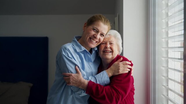 Mand adult daughter hugging, celebrating Mother's Day.