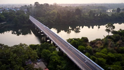 A tourist destination, a holiday retreat, a river, trees, a perfectly balanced and beautiful landscape, eco-friendly relaxation, photographed from a drone. © Mohwet