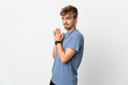 Young handsome man isolated on white background scheming something