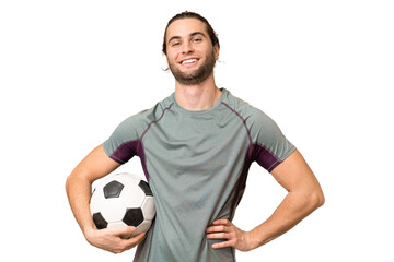 Young handsome football player man over isolated background posing with arms at hip and smiling © luismolinero