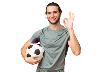 Young handsome football player man over isolated background showing ok sign with fingers © luismolinero