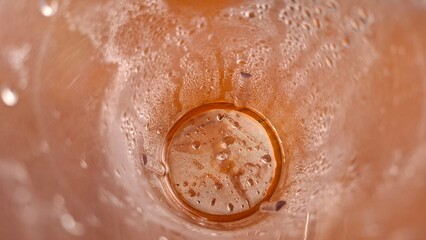 Fototapeta premium Top View of Brown Muddy Water in Container