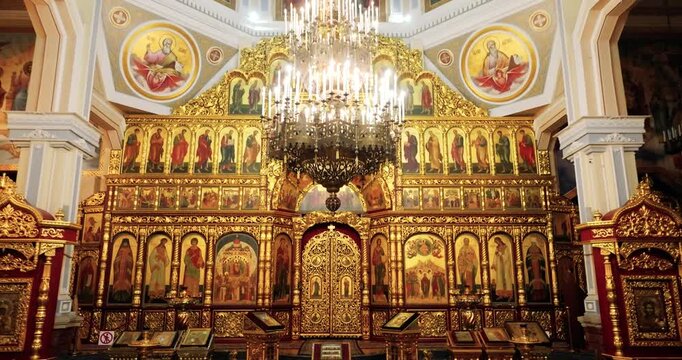 Elegant Golden Religious Monument. Opulent Golden Icon Screen With Ornate Design And Sacred Symbols