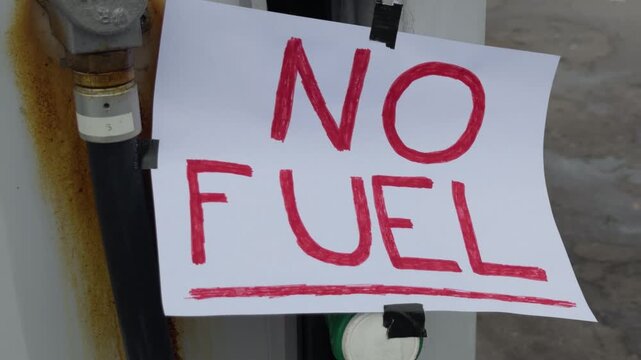 A sign has been posted at the gas pump because it's out of fuel.
