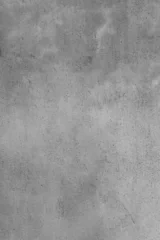 Fotobehang Beton Full frame monochrome grey concrete wall background featuring industrial cement textures with aged grunge details and mottled stone surface for modern architectural design.  © Selim Aysolmaz