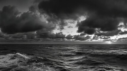 Obraz premium skim. A dramatic seascape at dusk with low, fast-moving clouds over a choppy ocean, an ominous storm approaching. travel magazines.