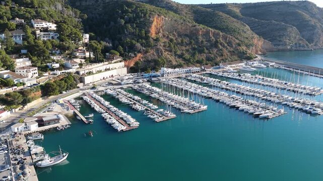 Drone flying above javea marina and coastline