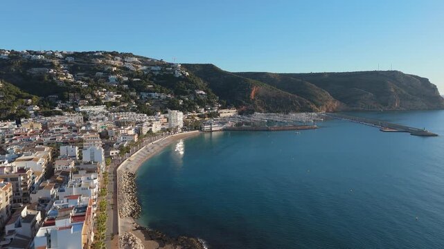 Drone flying over javea town coast and marina in spain